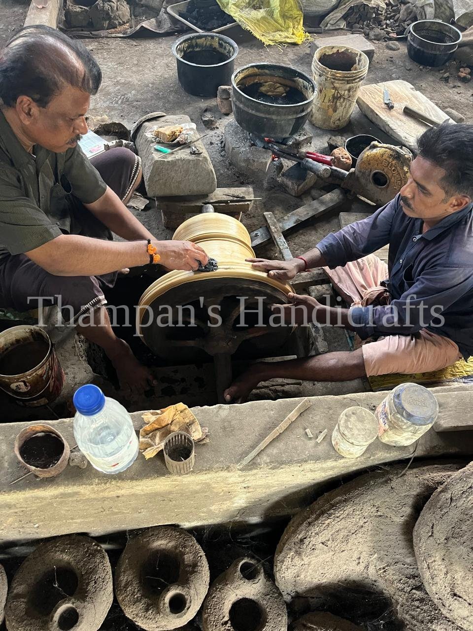 An artisan shaping a wax model by hand at the Mannar foundry